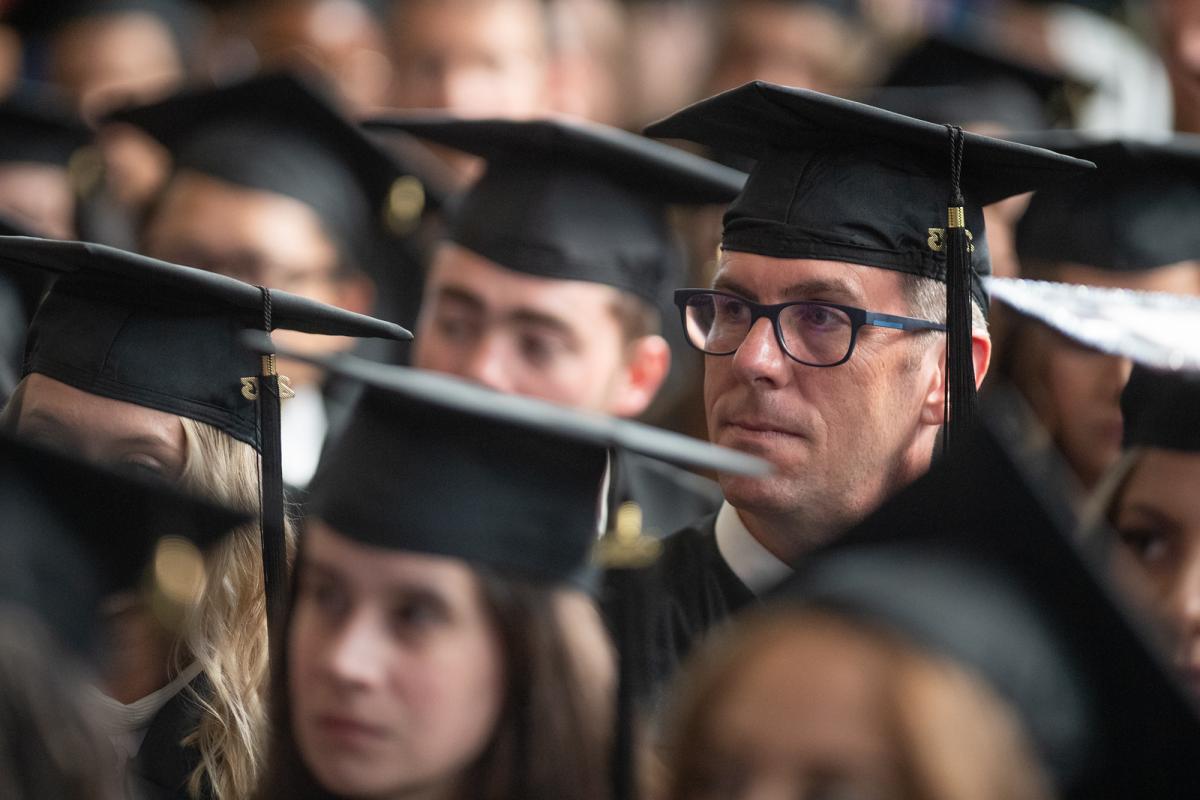 Students at Graduate Commencement wearing caps