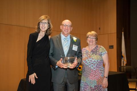 Former Chairman of Westfield State’s Board of Trustees and current member, Dr. Robert A. Martin was presented with an Honorary Alumnus Award from Framingham State University’s President Nancy Niemi, left, and President of the Alumni Association, Kelly Sardella Whitmore, right. (Framingham State University photo)