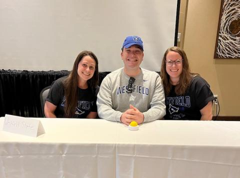 Taylor Saimeri, Jennifer Petrucci, and Andrew Allard sit behind a white table as they prepare to compete at the 2023 MAPA Challenge Bowl Competition.