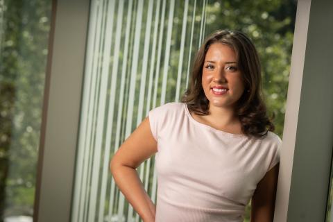 Madi Loik poses for a professional headshot.