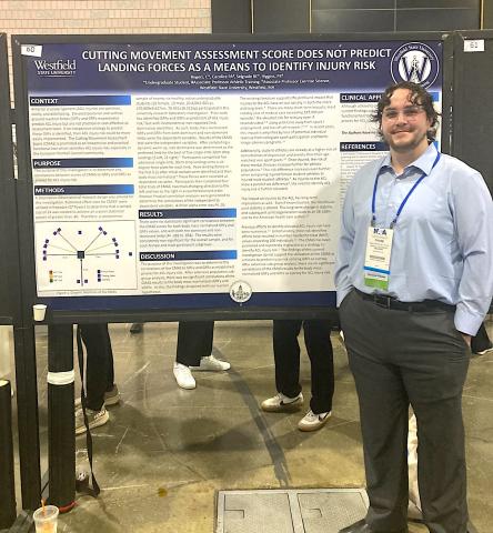 Student presenting research findings at convention.