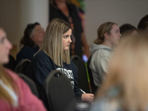 EGST student listening at film screening event 