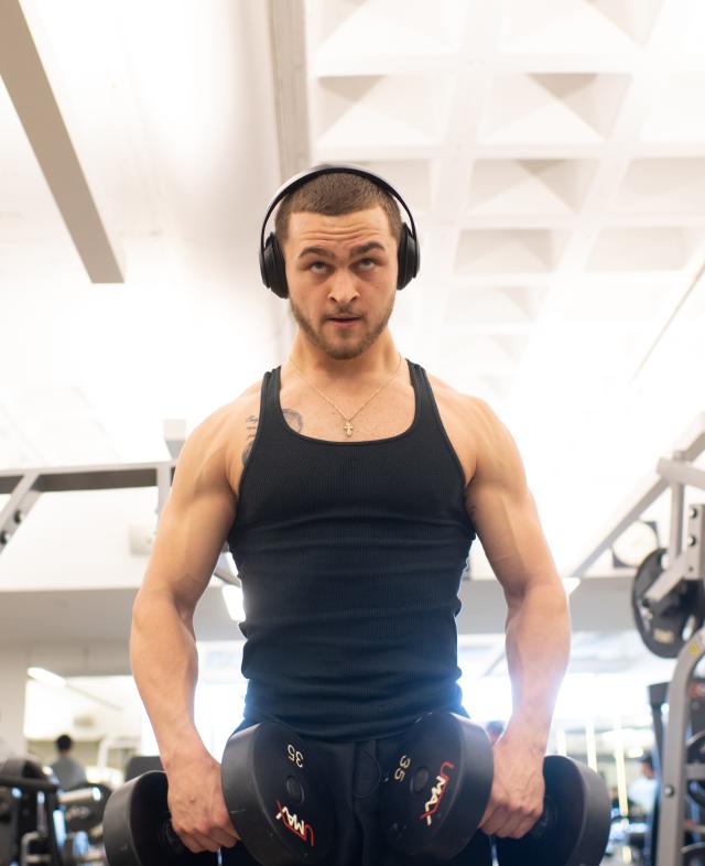 Student Working out with Dumbbells