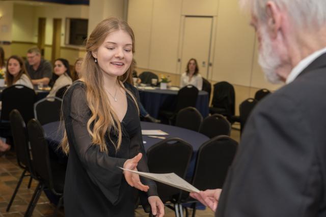 English student at honors ceremony.