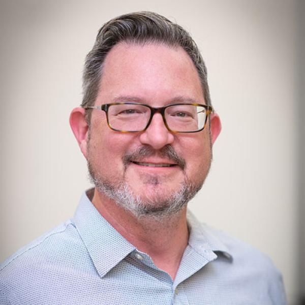 Dr. Nicholas Aieta, Chair of the History and Philosophy Department at Westfield State University, smiles for a professional photo.